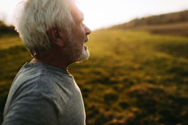 Portrait of senior man, outdoors in nature