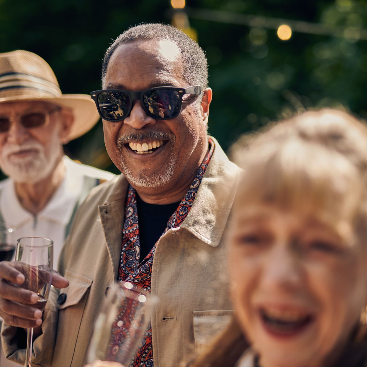 a group of older people celebrating