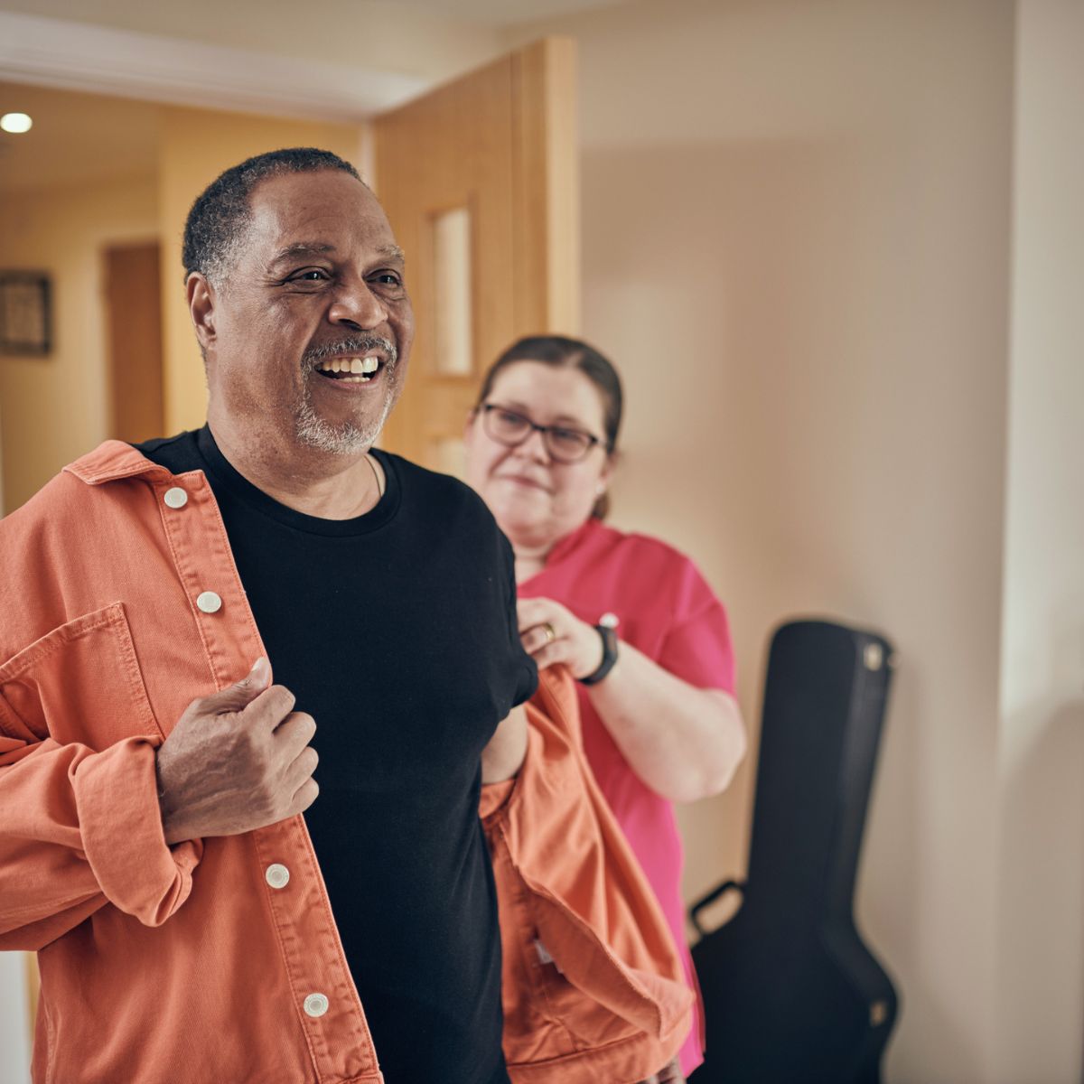 Carer helping resident change